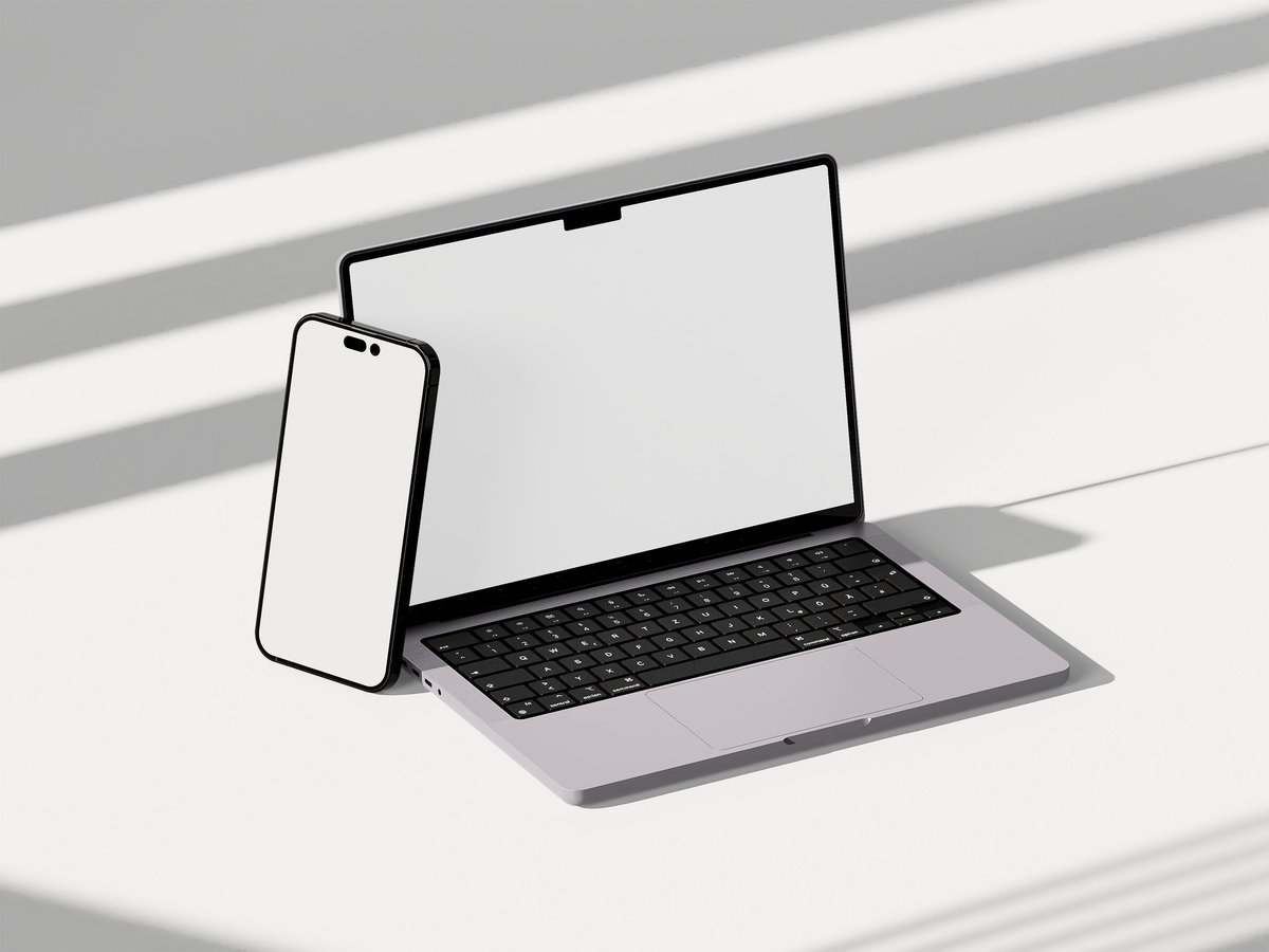 Mobilanpassad design visad på laptop och telefon